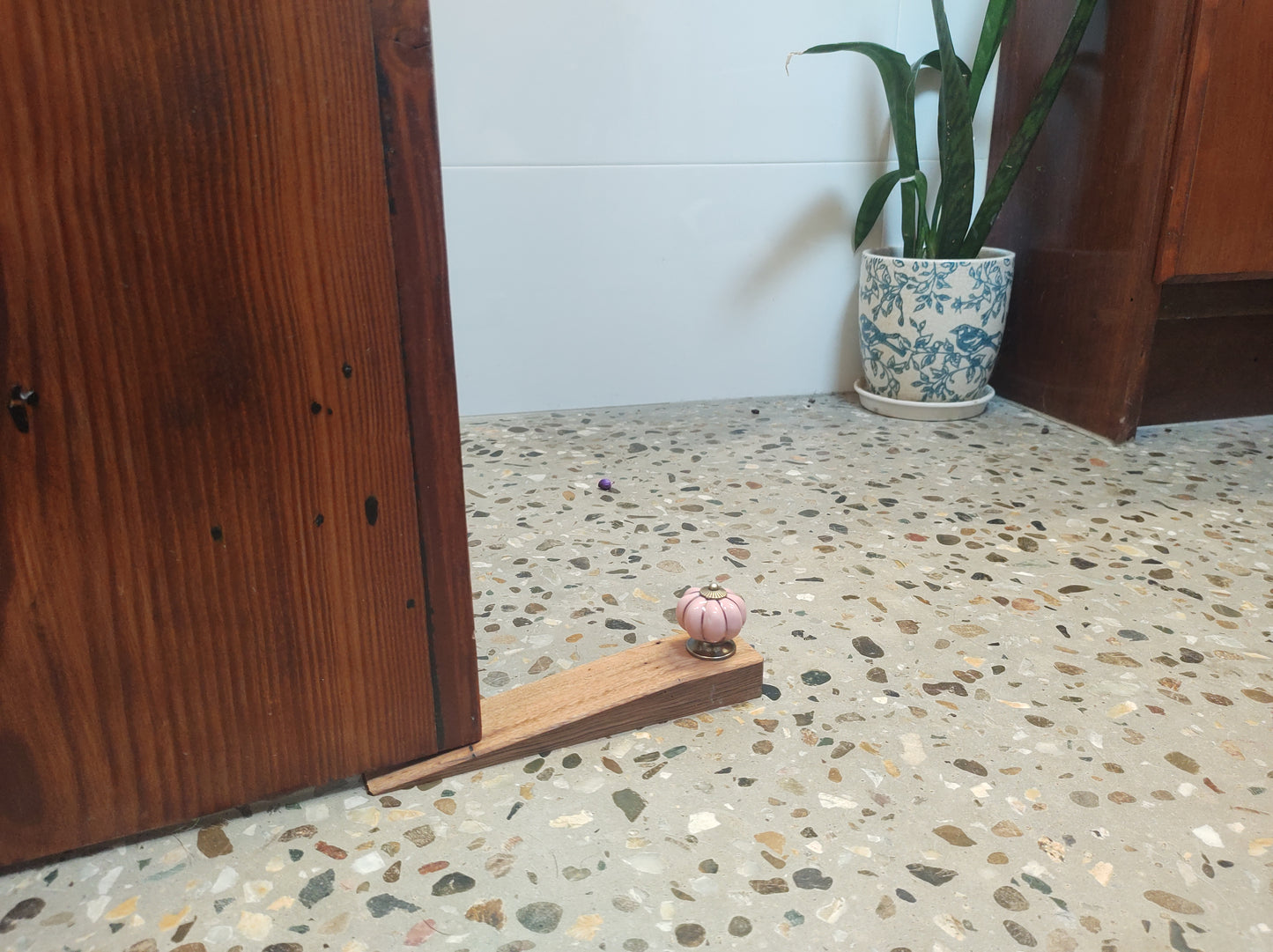 Door stop - Pink knob on Blonde timber.