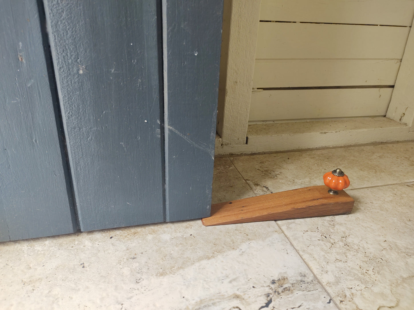 Door stop - Plain Orange knob on Blonde timber.