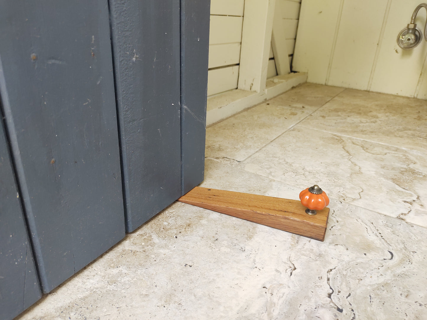 Door stop - Plain Orange knob on Blonde timber.