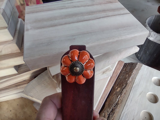 Door stop, Orange knob with Gold flutes on Red timber.